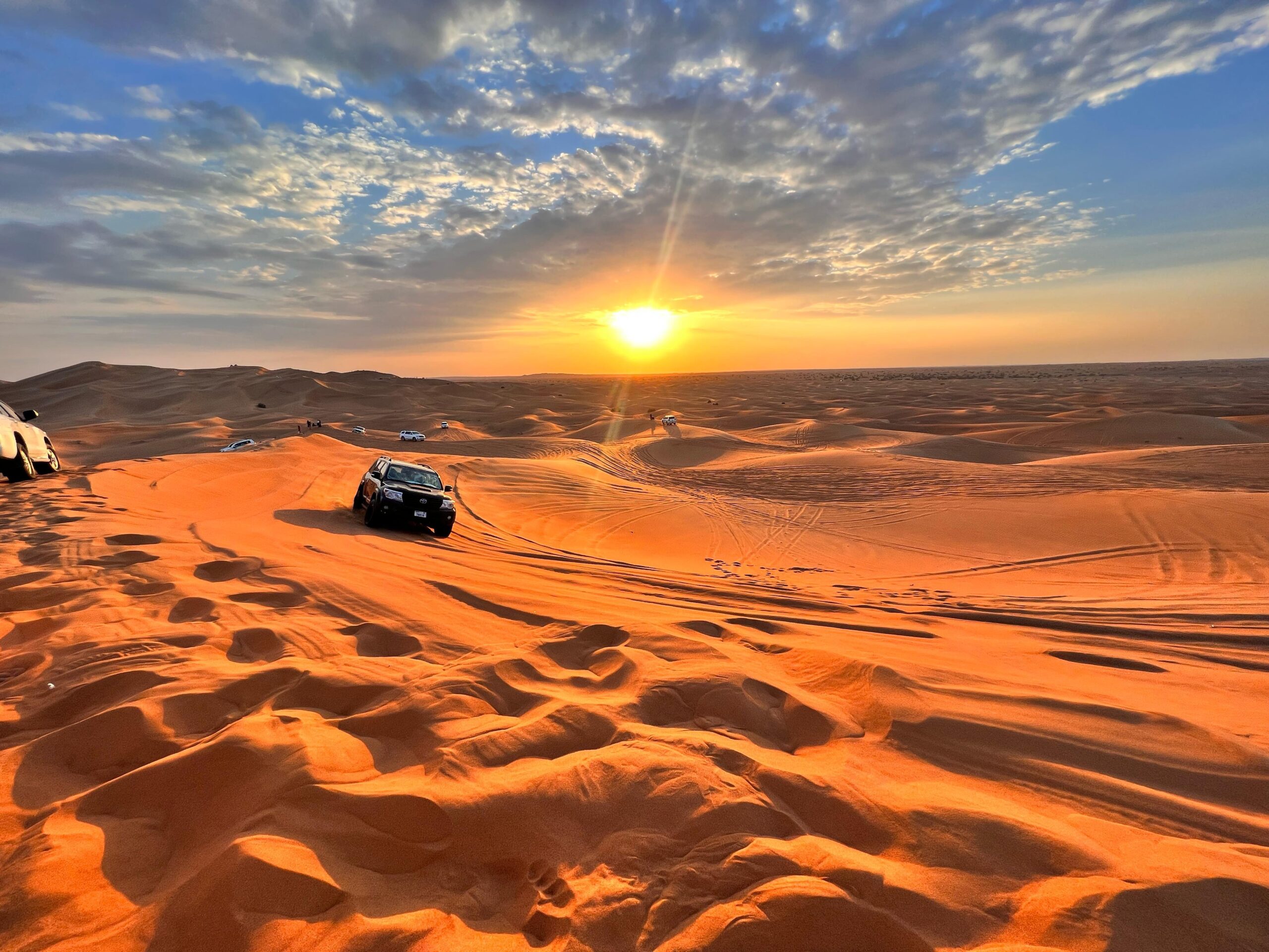 Dubai desert safari with golden sand dunes and a 4x4 vehicle